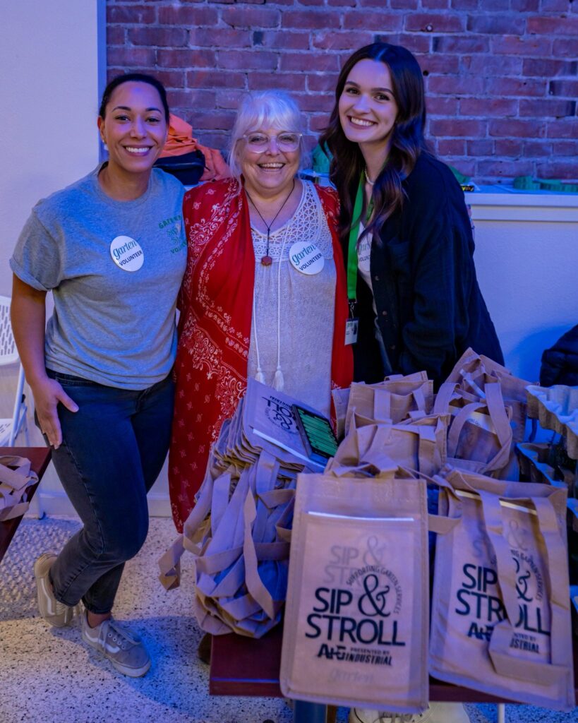 A trio of volunteers poses for a photo. 