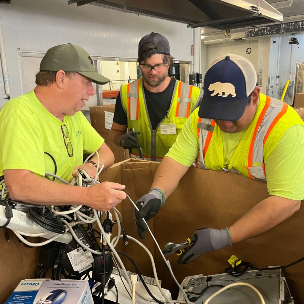 Our e-recycling team working at their new home on Hawthorne. 