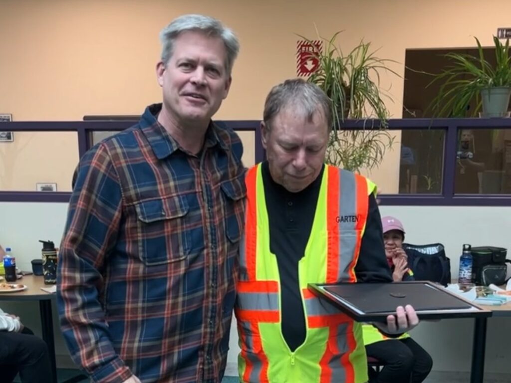 CEO Will Posegate Congratulates Pete Grell on 28 Years of Service.