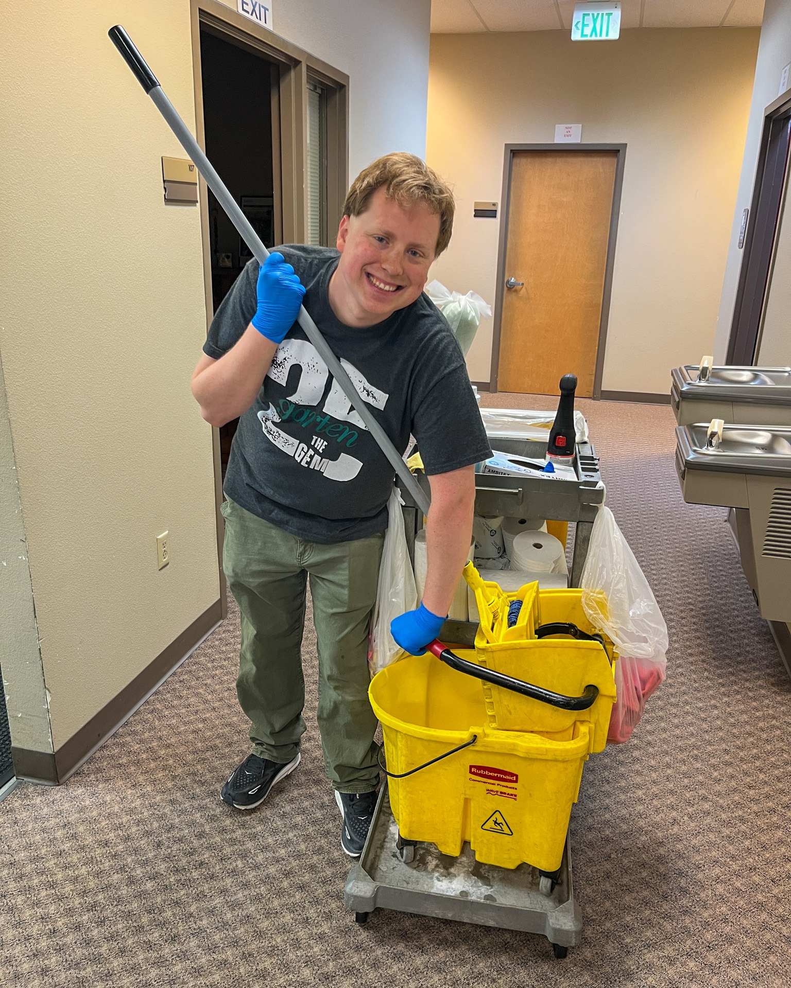 Team performing routine cleaning in a large commercial facility.