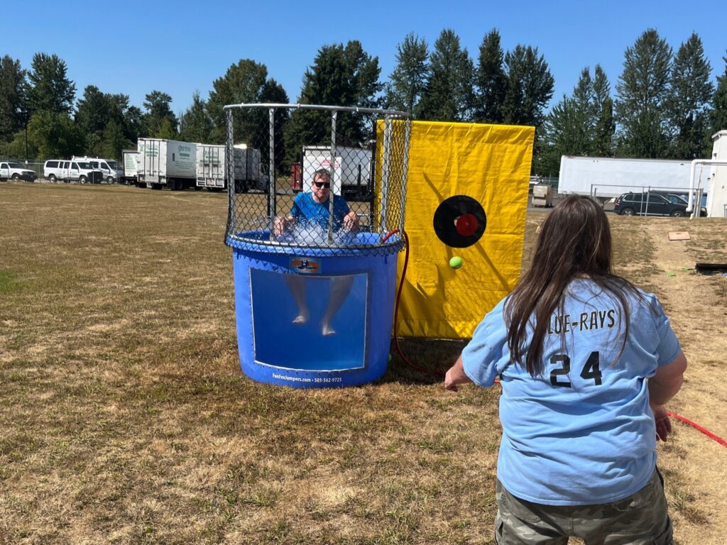 CEO, will Posegate, getting dunked in the Garten Summer Celebration. 