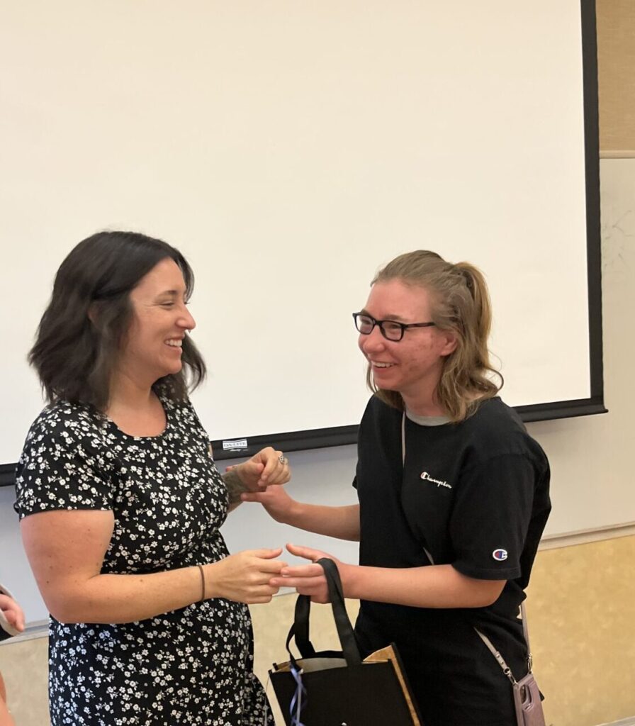 Summer youth graduation with job coach.