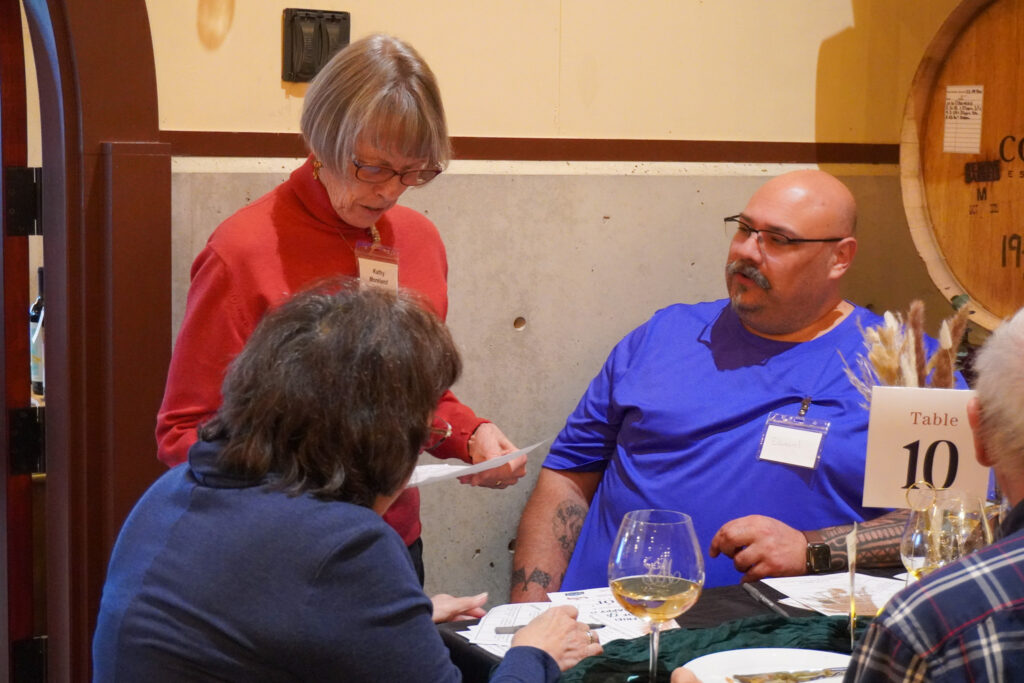 Garten Board Member socializing at the Friends of Garten Happy Hour. 