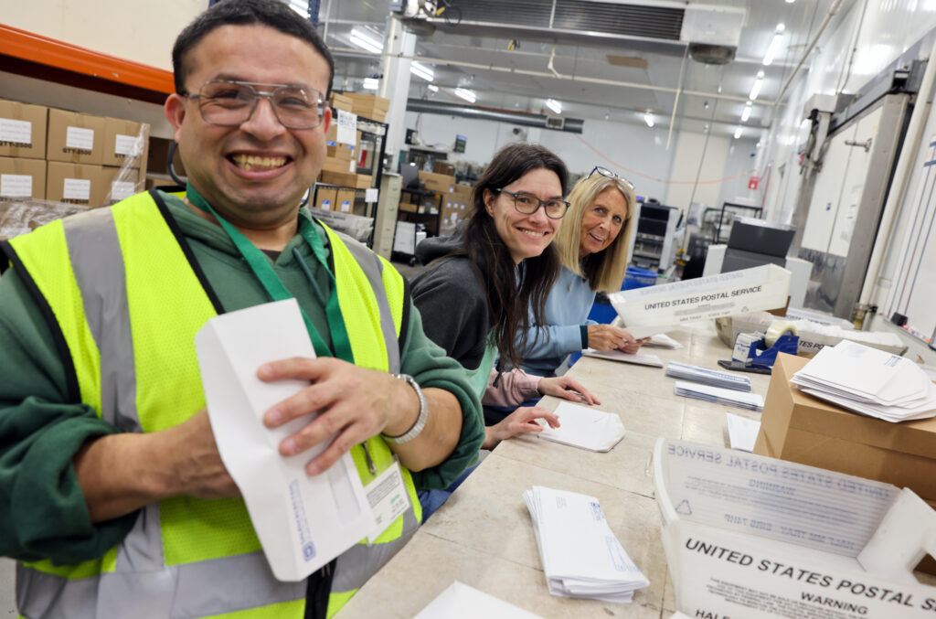 Team members collaborating in a supportive environment that promotes autism inclusion and employment opportunities.